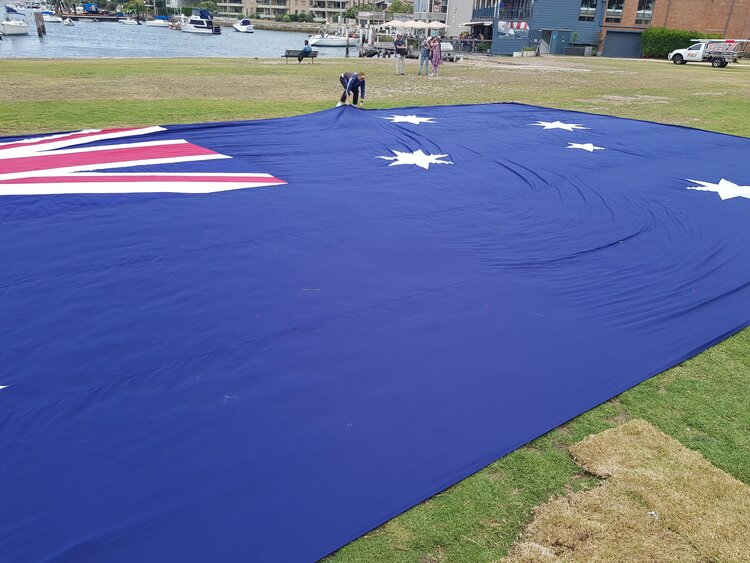 Large helicopter flag out in a park