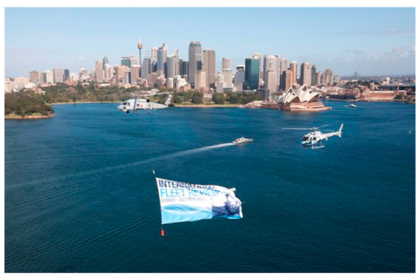 Defence force flag flying under helicopter