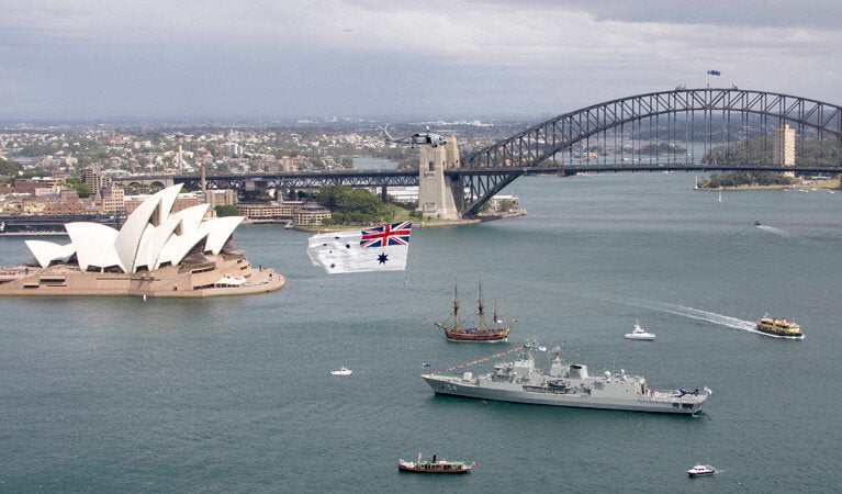 White ensign helicopter flag flying over harbour 